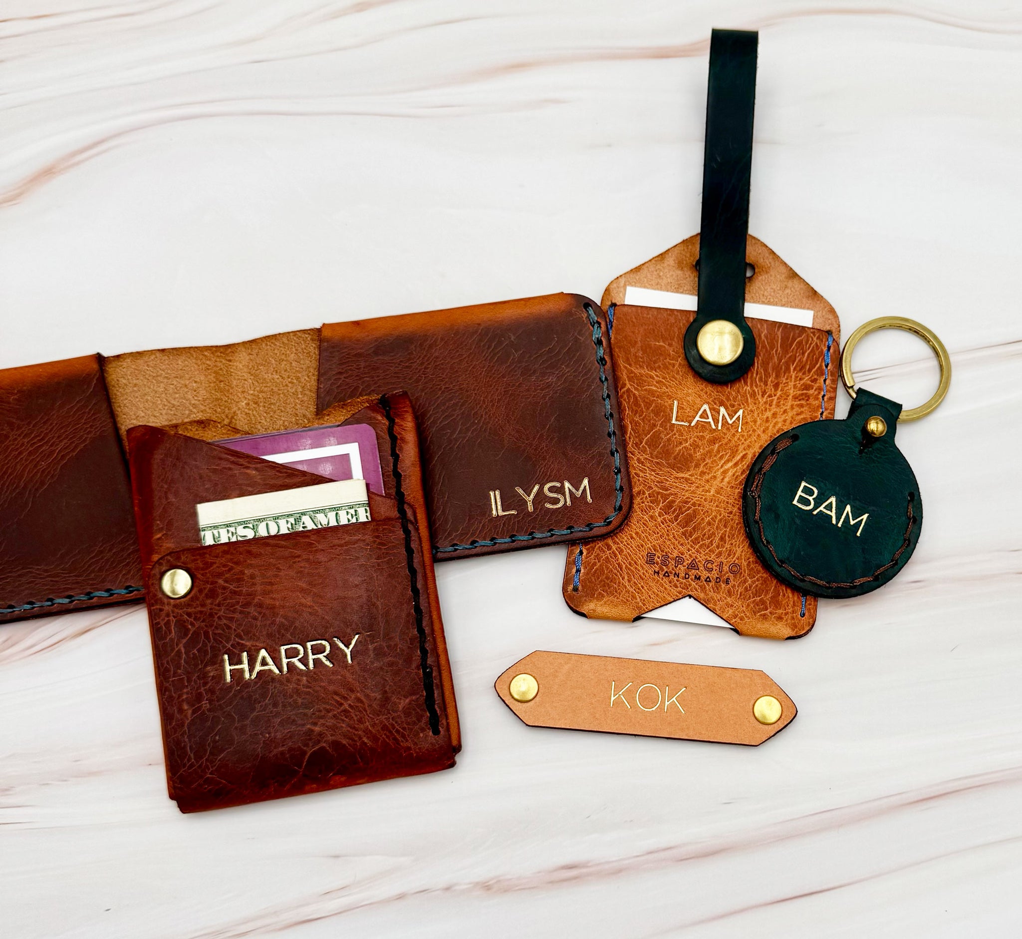 Espacio Handmade Monogrammed leather wallets, luggage tags, bookmarks and keychains for brand activations